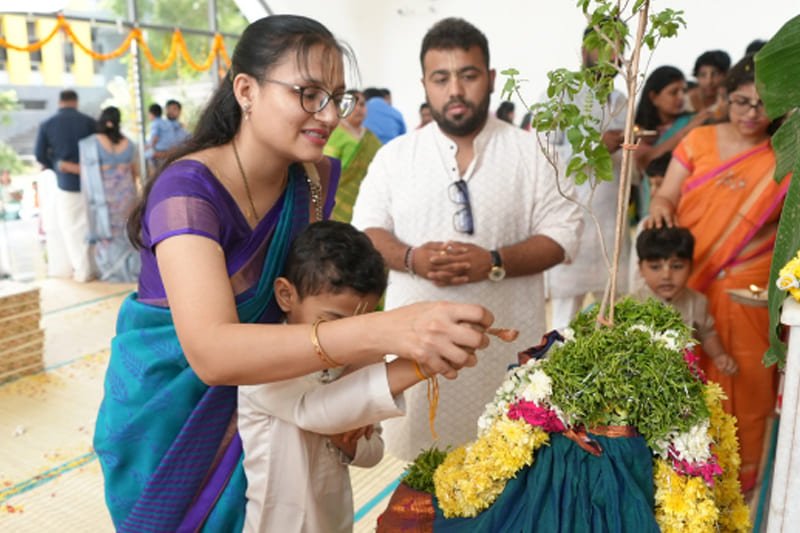 Mother and child offering prayers during Vandanam at Basil Woods